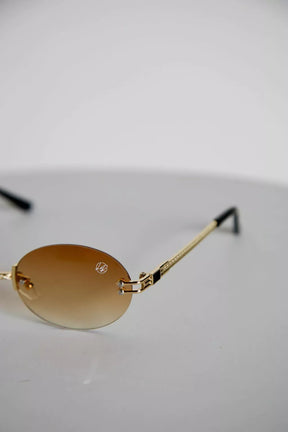 ÓCULOS OVAL LENTES DEGRADÊ ARMAÇÃO DOURADA 063